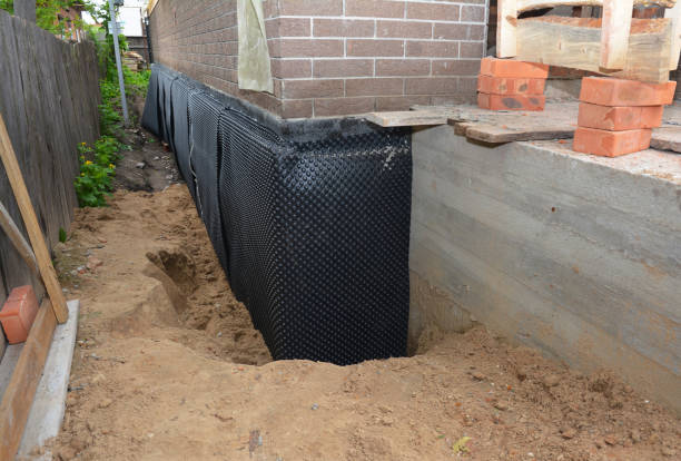 Happy homeowners after waterproofing job in Adell